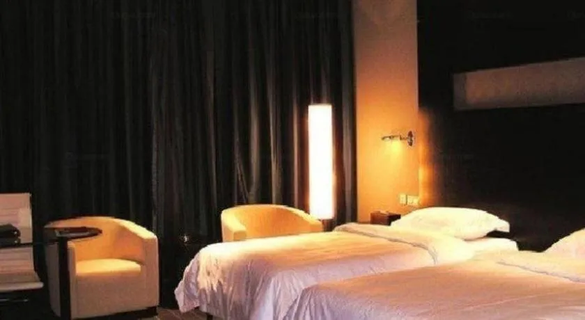 Bed in Guangdong Nanmei Osotto Hotel