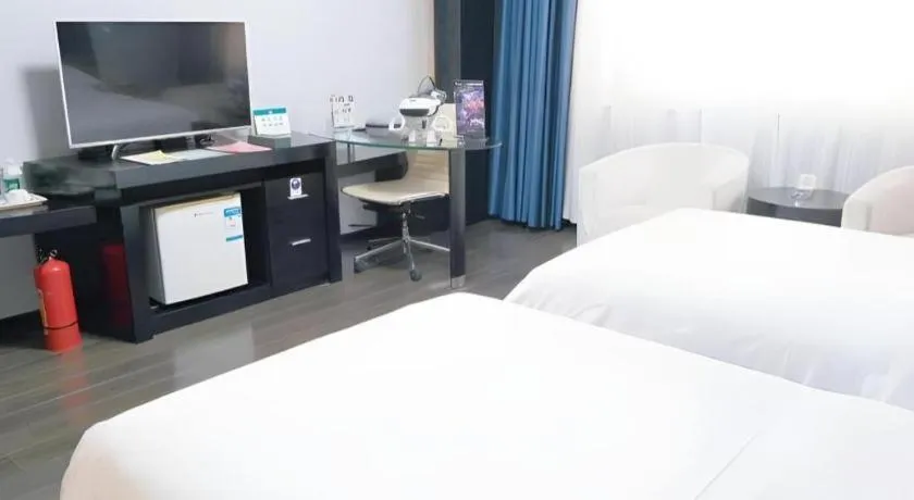 Bed in Guangdong Nanmei Osotto Hotel