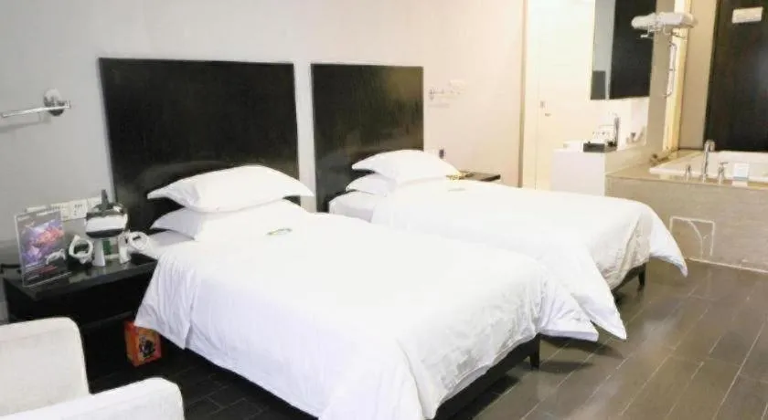 Bed in Guangdong Nanmei Osotto Hotel