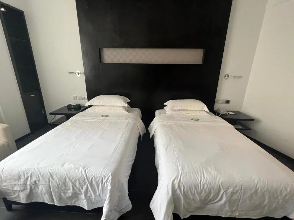 Bed in Guangdong Nanmei Osotto Hotel