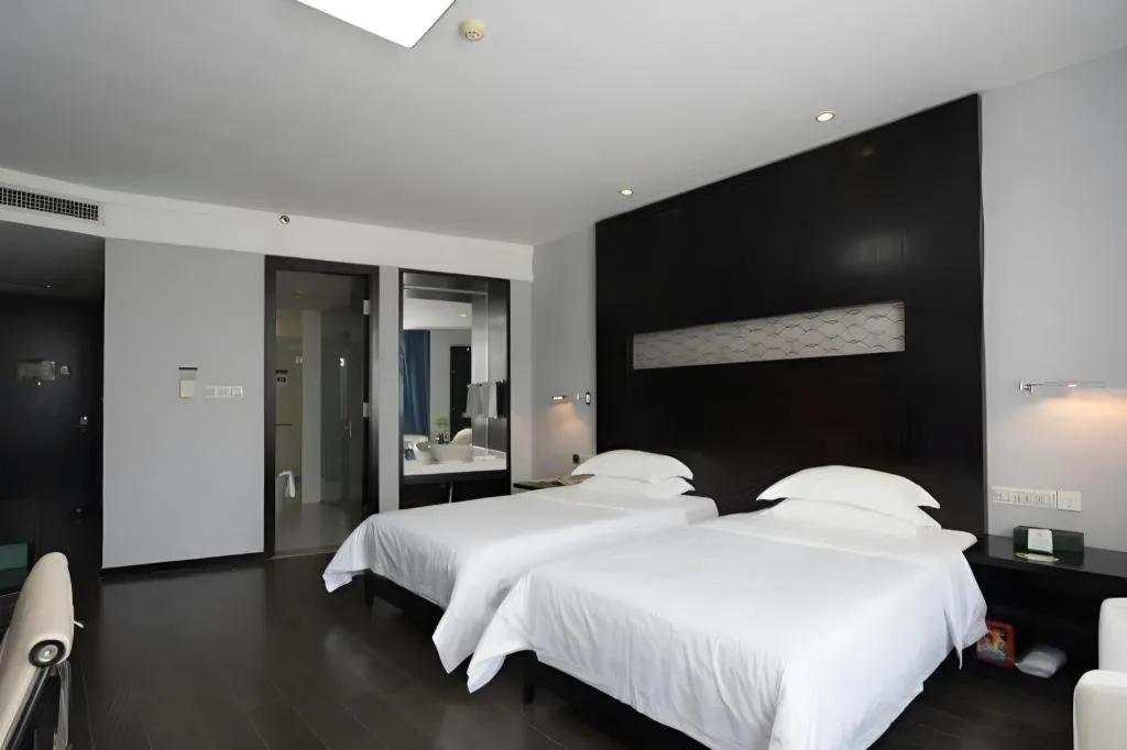 Bed in Guangdong Nanmei Osotto Hotel