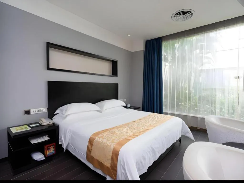 Bed in Guangdong Nanmei Osotto Hotel