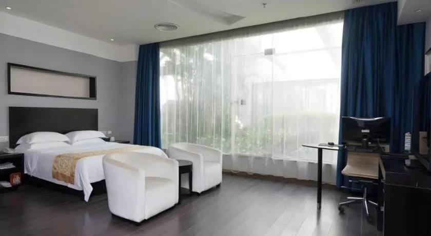 Bed in Guangdong Nanmei Osotto Hotel