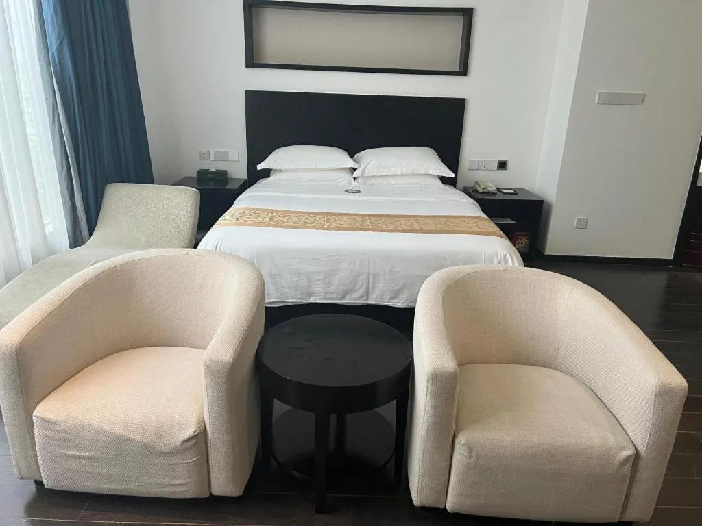 Bed in Guangdong Nanmei Osotto Hotel