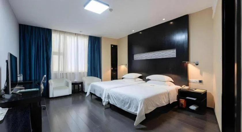 Bed in Guangdong Nanmei Osotto Hotel