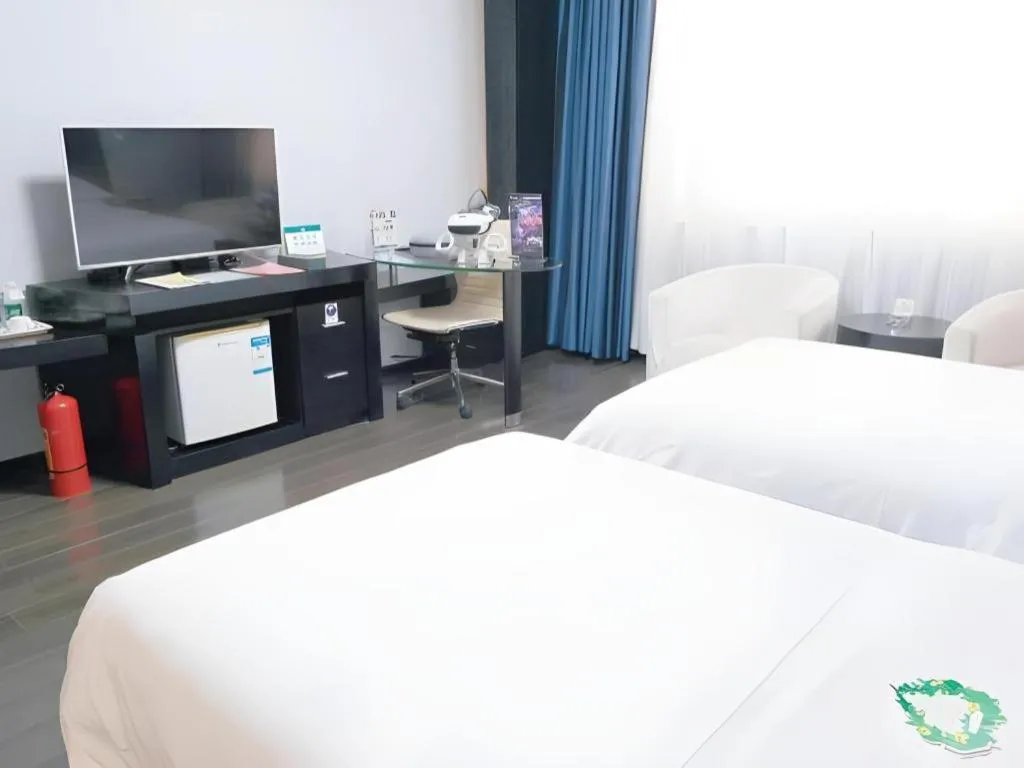 Bed in Guangdong Nanmei Osotto Hotel