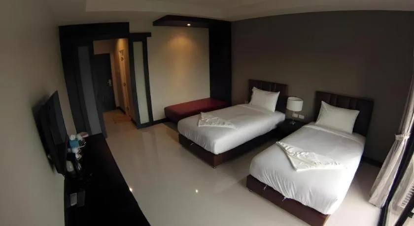 Bed in Villa Thiwa Hotel