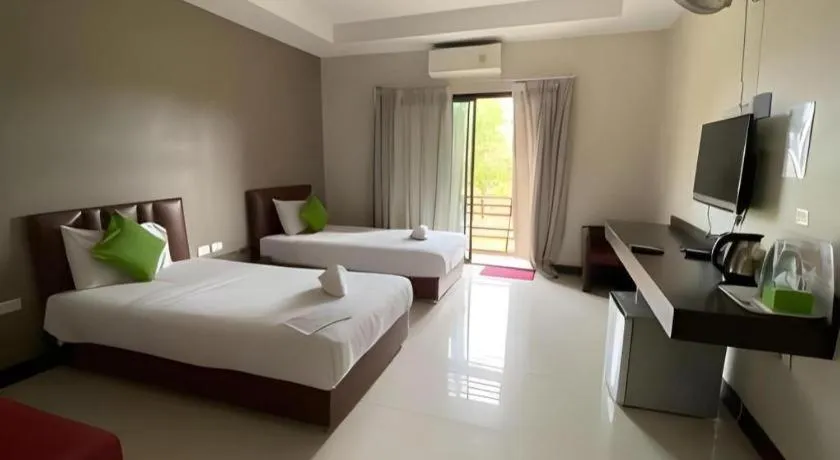 Bed in Villa Thiwa Hotel