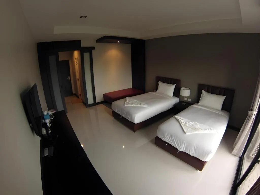 Bed in Villa Thiwa Hotel