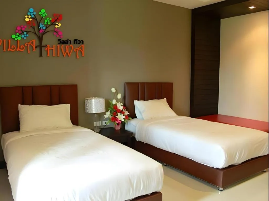 Bed in Villa Thiwa Hotel