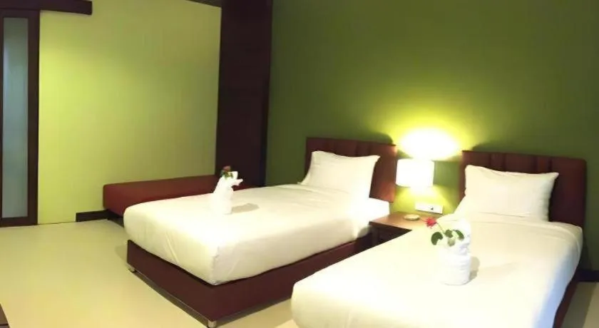 Bed in Villa Thiwa Hotel