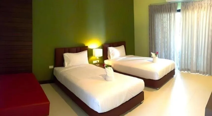 Bed in Villa Thiwa Hotel