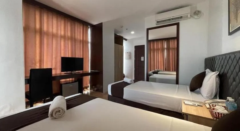 Bed in Capitol Central Hotel and Suites