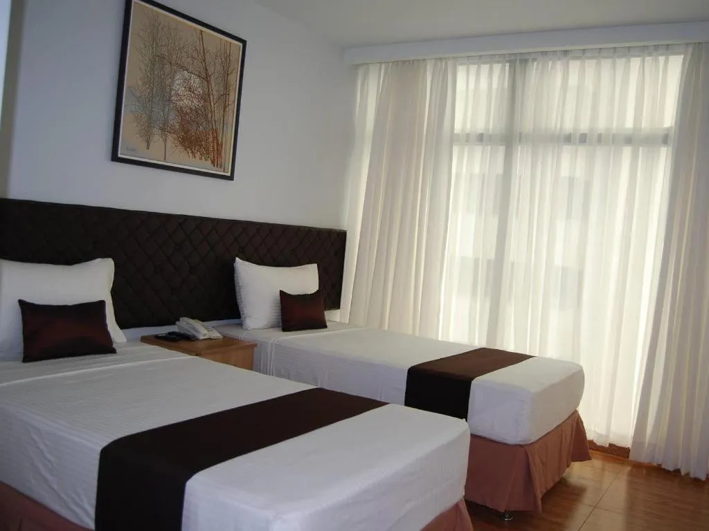 Bed in Capitol Central Hotel and Suites