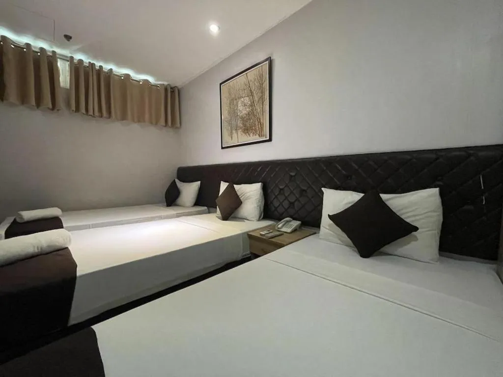 Bed in Capitol Central Hotel and Suites