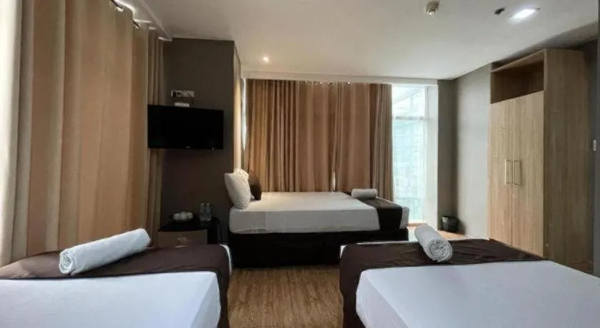 Bed in Capitol Central Hotel and Suites