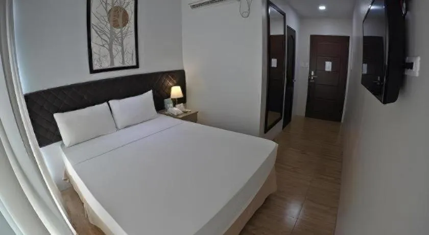 Bed in Capitol Central Hotel and Suites