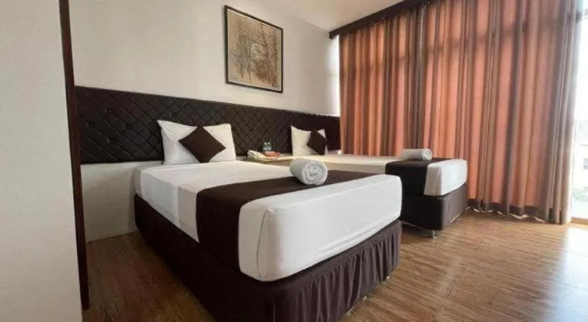 Bed in Capitol Central Hotel and Suites