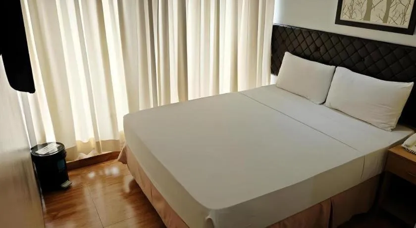 Bed in Capitol Central Hotel and Suites