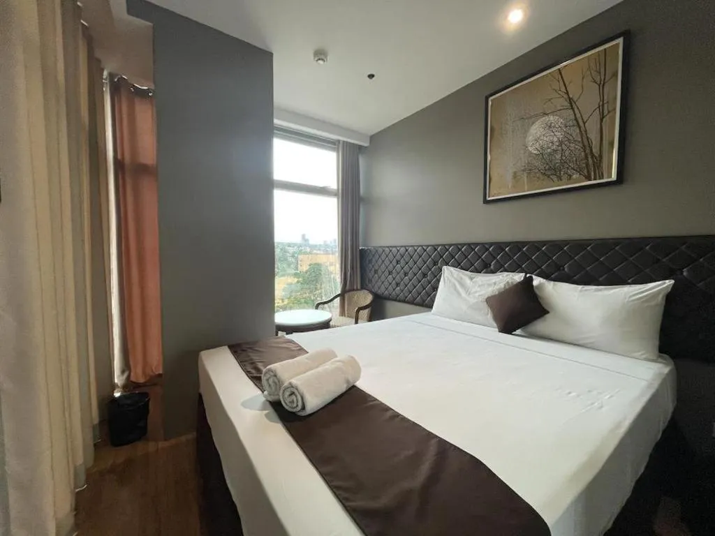 Bed in Capitol Central Hotel and Suites