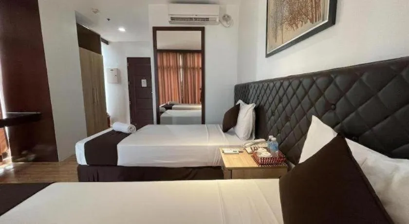 Bed in Capitol Central Hotel and Suites