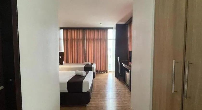 Bed in Capitol Central Hotel and Suites