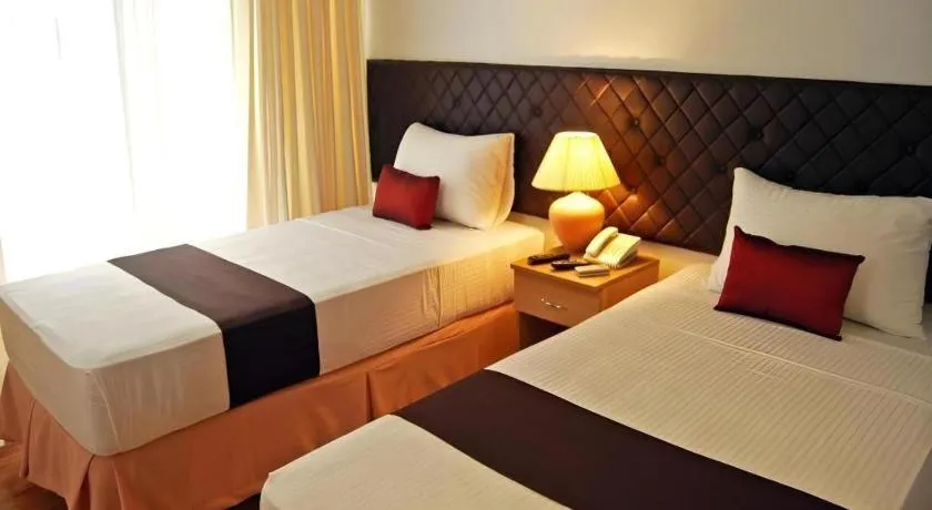 Bed in Capitol Central Hotel and Suites