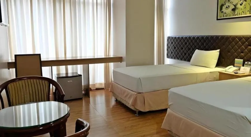 Bed in Capitol Central Hotel and Suites