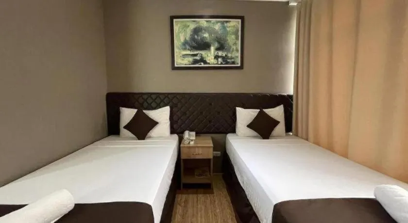 Bed in Capitol Central Hotel and Suites
