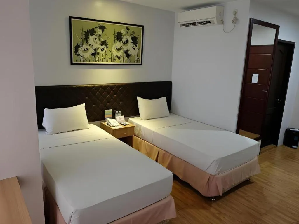 Bed in Capitol Central Hotel and Suites