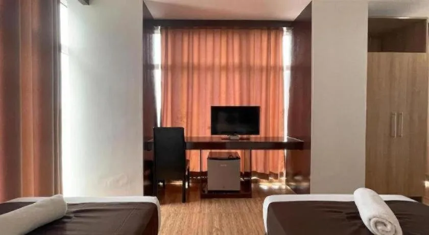 Bed in Capitol Central Hotel and Suites