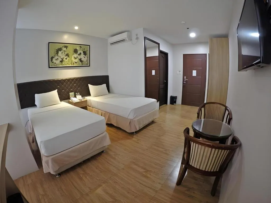 Bed in Capitol Central Hotel and Suites