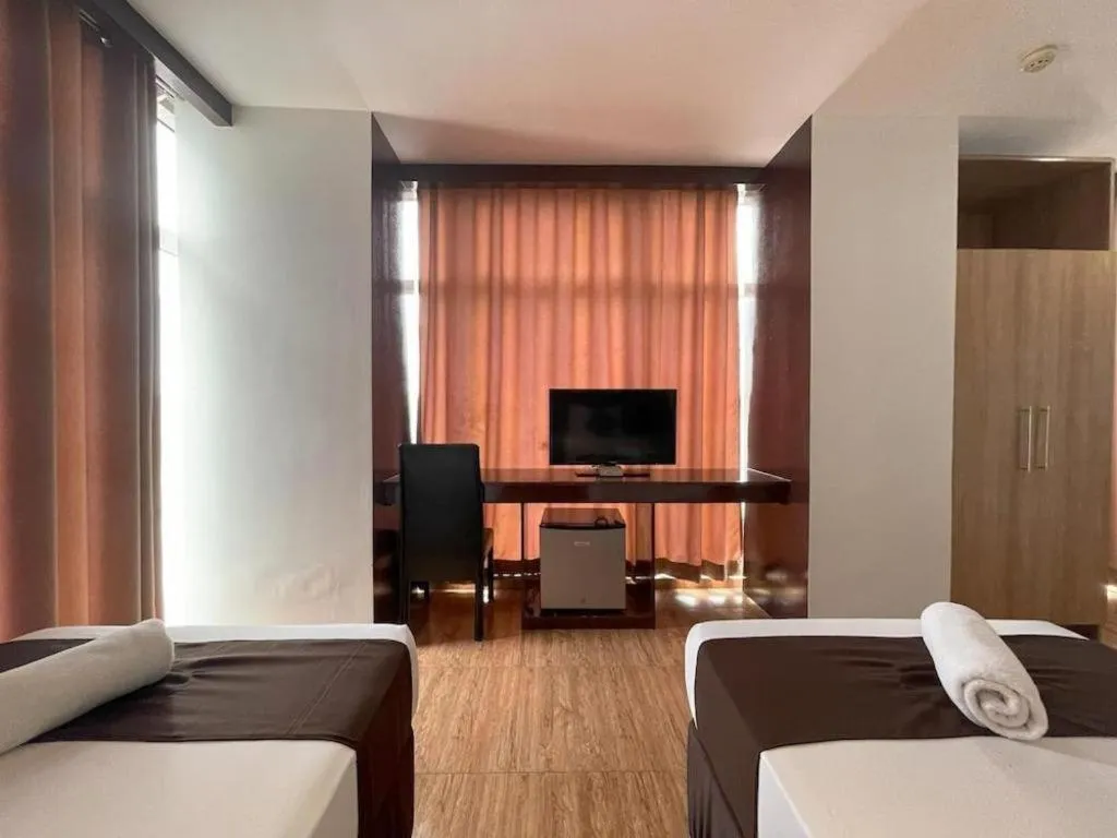 Bed in Capitol Central Hotel and Suites