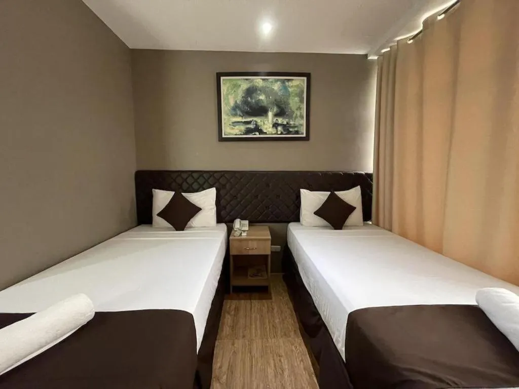 Bed in Capitol Central Hotel and Suites