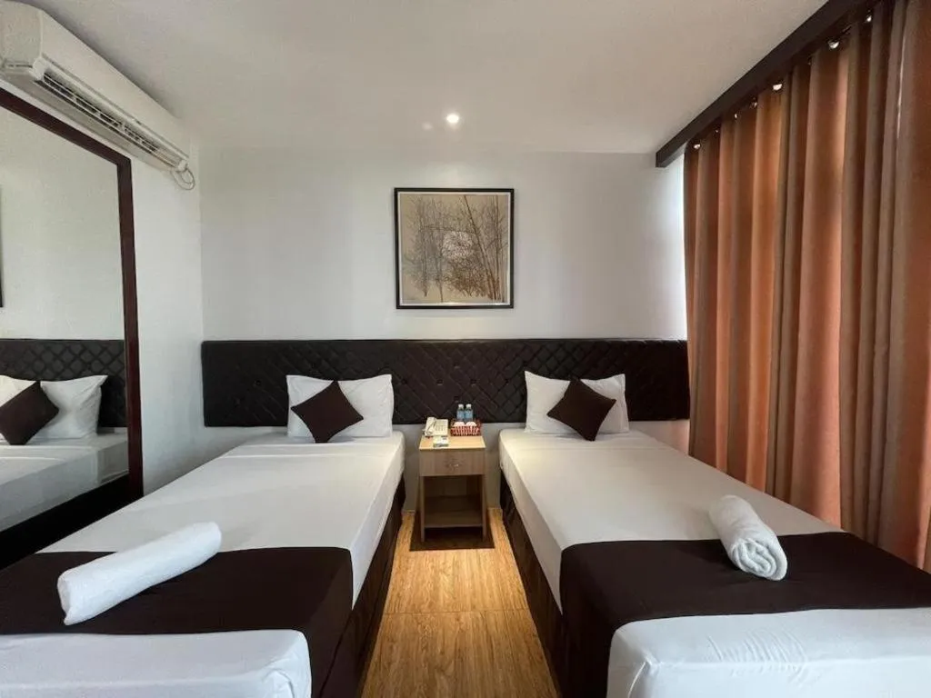 Bed in Capitol Central Hotel and Suites