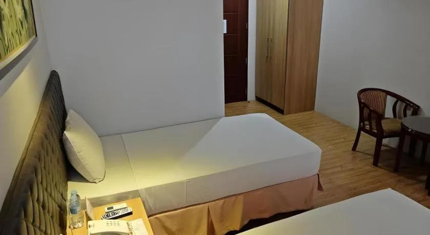 Bed in Capitol Central Hotel and Suites