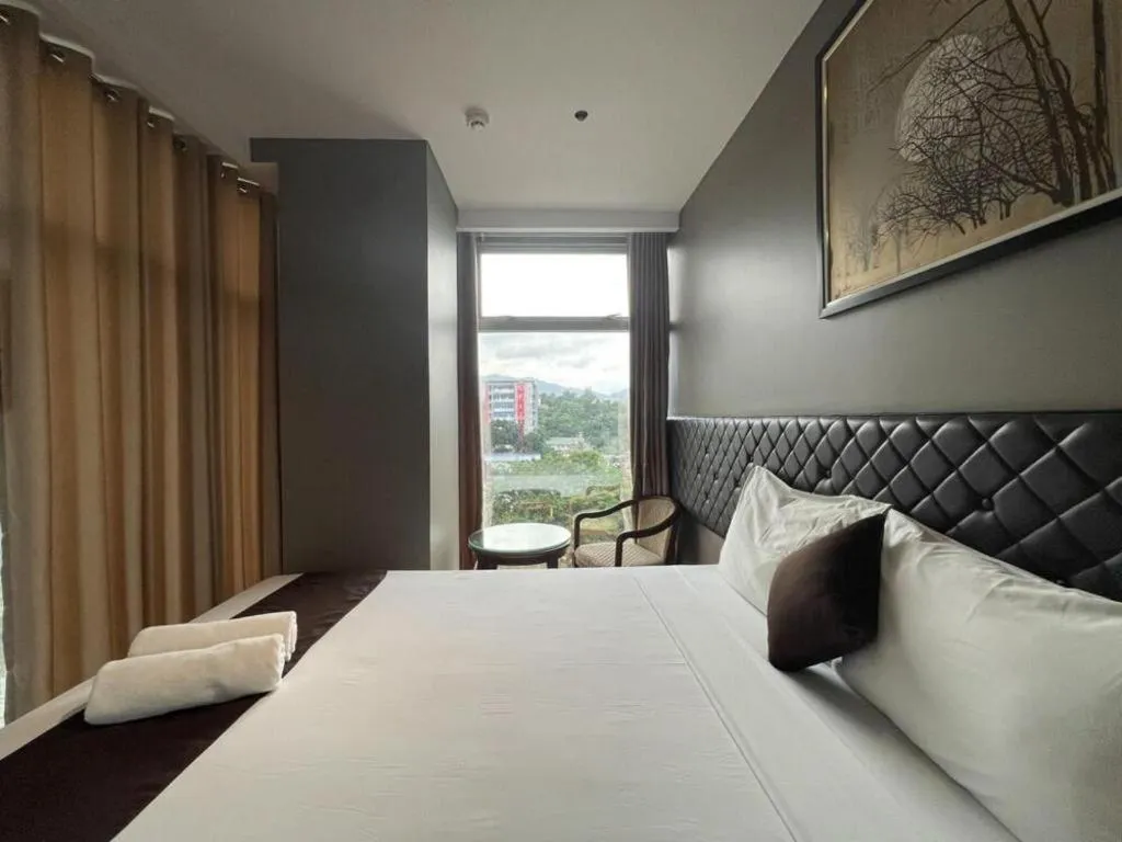 Bed in Capitol Central Hotel and Suites