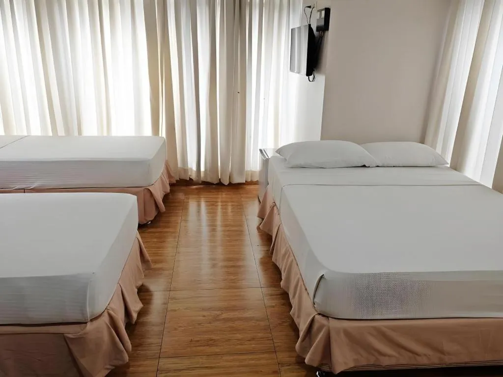 Bed in Capitol Central Hotel and Suites