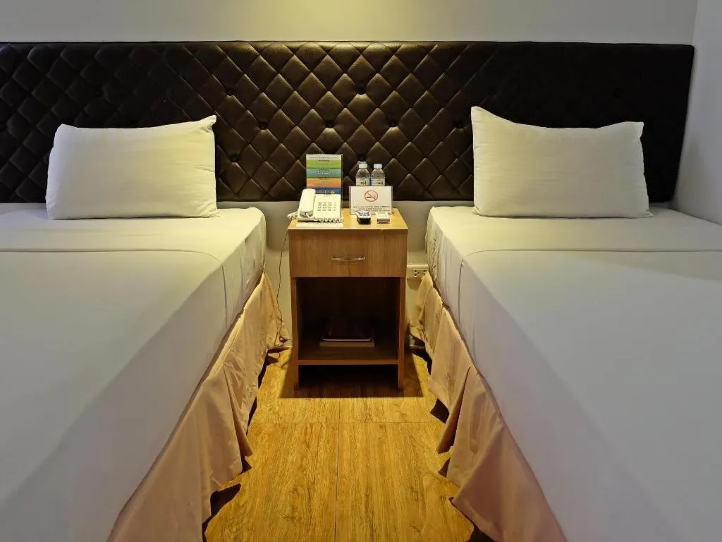 Bed in Capitol Central Hotel and Suites