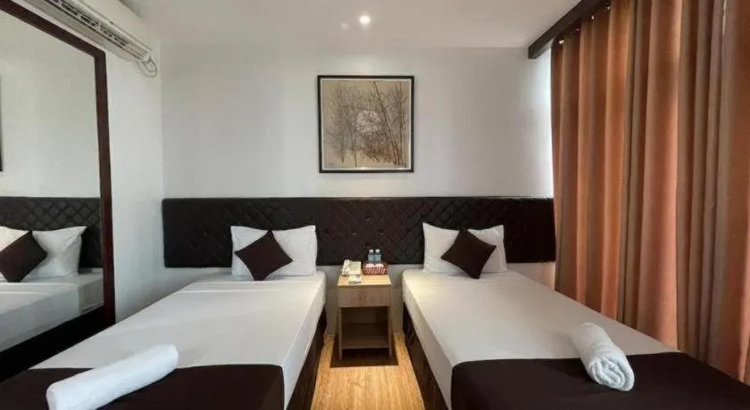 Bed in Capitol Central Hotel and Suites