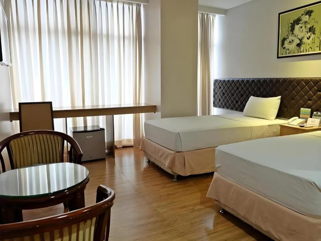 Bed in Capitol Central Hotel and Suites