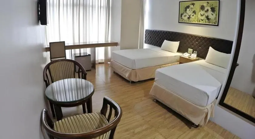 Bed in Capitol Central Hotel and Suites