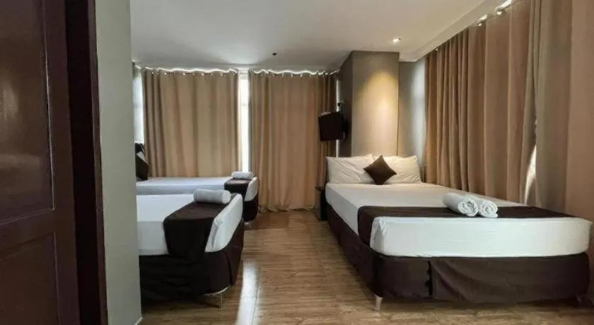 Bed in Capitol Central Hotel and Suites