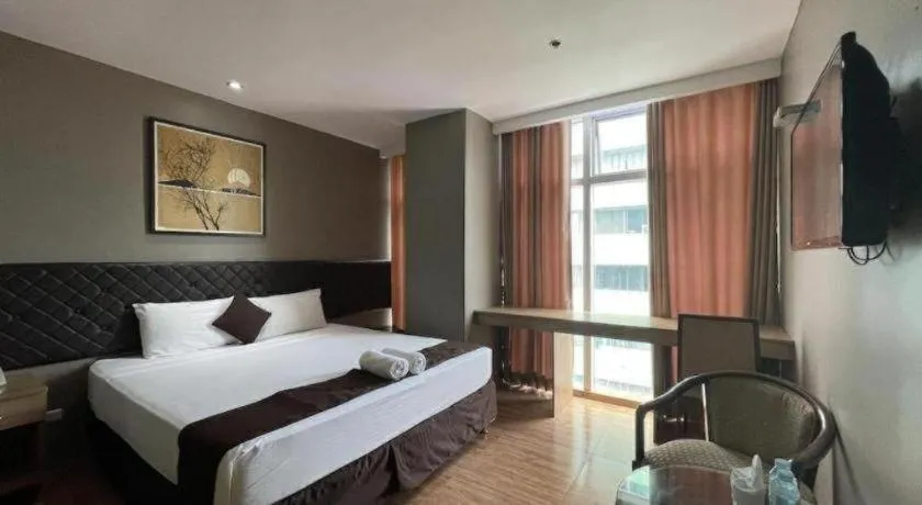 Bed in Capitol Central Hotel and Suites