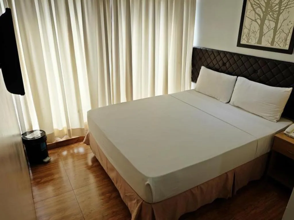 Bed in Capitol Central Hotel and Suites