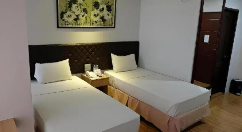 Bed in Capitol Central Hotel and Suites
