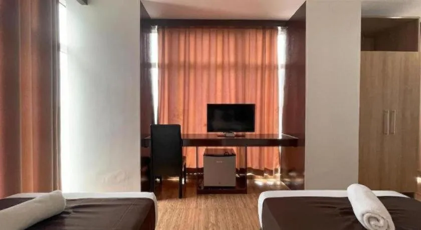 Bed in Capitol Central Hotel and Suites