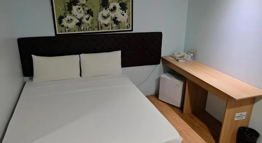 Bed in Capitol Central Hotel and Suites