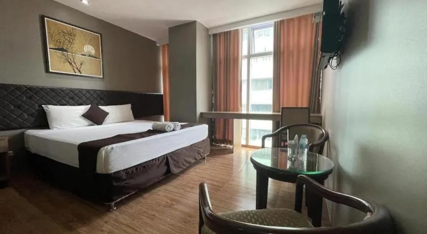 Bed in Capitol Central Hotel and Suites