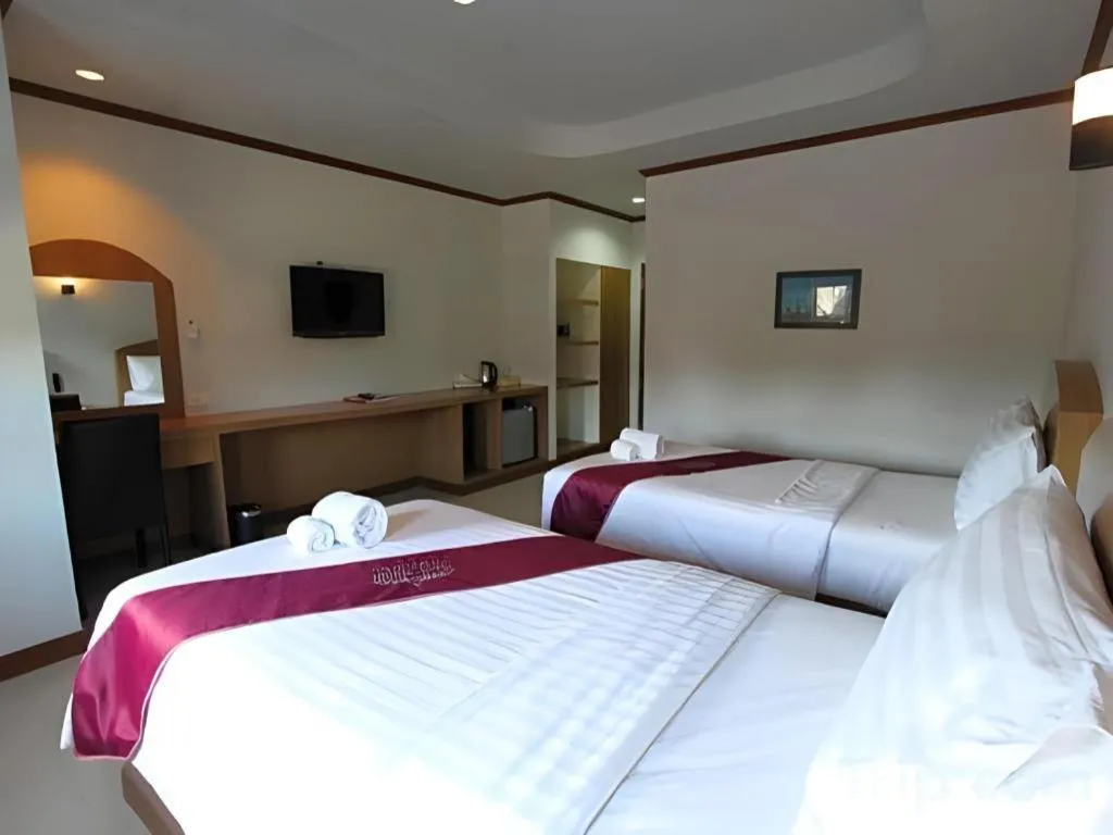 Bed in Thada Chateau Hotel